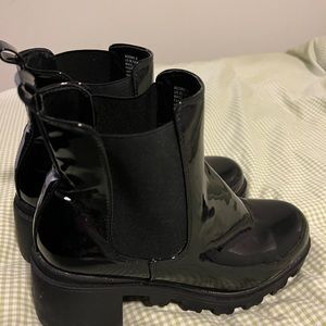 Black shiny heeled boots